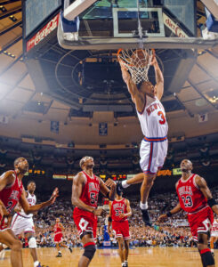 John Starks #3 of the New York Knicks dunks against the Chicago Bulls during the NBA Playoffs.